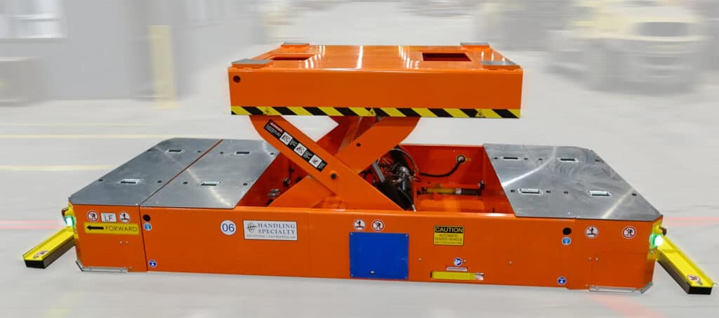 Orange AGV with scissor lift up. These is one of the types of automated guided vehicles.