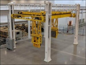 4-post lift system in an industrial warehouse.
