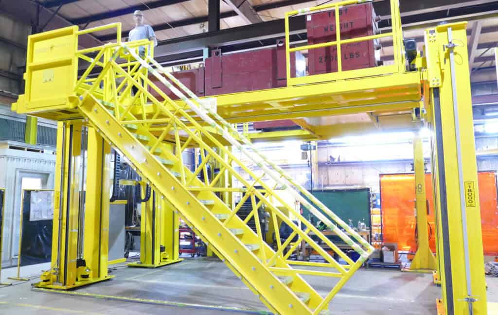 4-Post electromechanical lifting systems with stairs and platform.