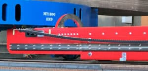 Rail guided vehicles pulling load
