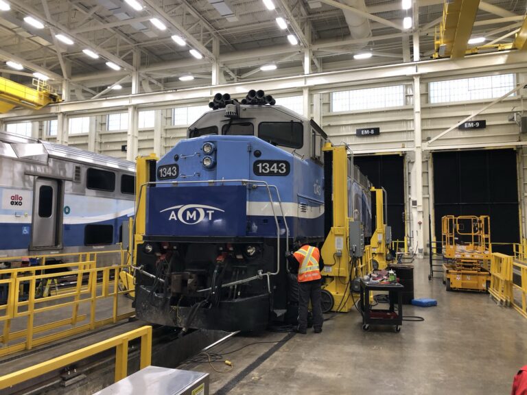 Electric jacks under train car